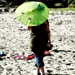 Full length of woman standing on railing