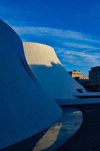 View of buildings against blue sky