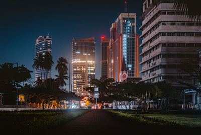 Illuminated buildings in city at night