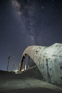 Low angle view of windmill against sky at night