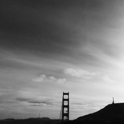 Low angle view of silhouette built structure against sky