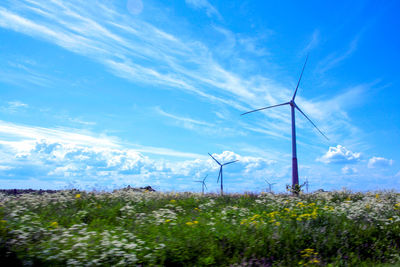 Wind turbines in field