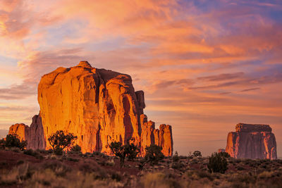 Rock formations against sky during sunset