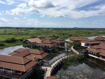 High angle view of houses and buildings against sky