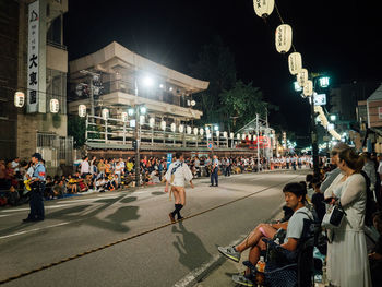 People on city street at night