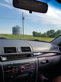 Reflection of car on cloudy sky