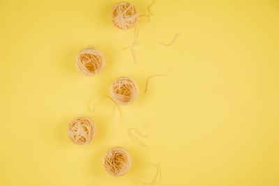High angle view of lemon against yellow background
