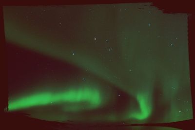 Scenic view of landscape against sky at night