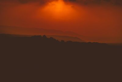 Scenic view of silhouette landscape against sky during sunset