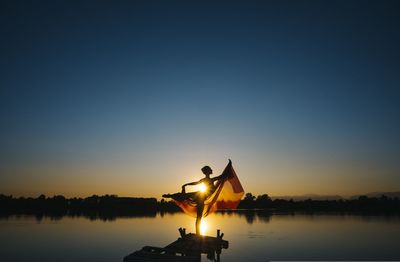 Woman dancing on the lake