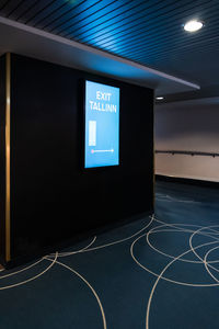 Information sign on illuminated wall