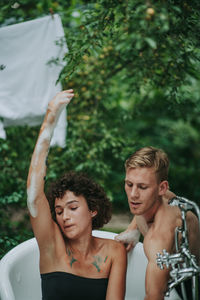 Young couple looking at camera