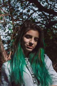 Portrait of young woman in forest