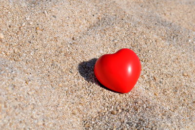 Close-up of heart shape on sand