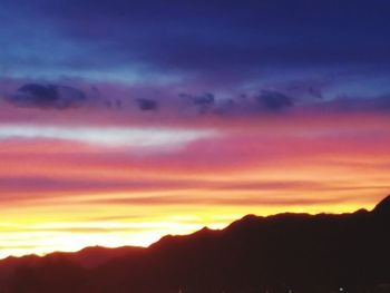 Scenic view of dramatic sky during sunset