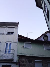 Low angle view of building against blue sky