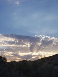 Scenic view of silhouette mountain against sky during sunset