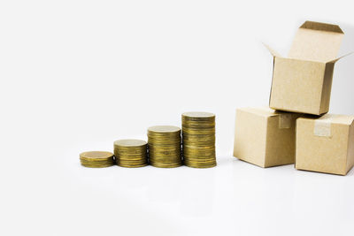 Close-up of coin stack against white background