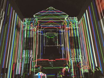 Low angle view of illuminated ceiling at night