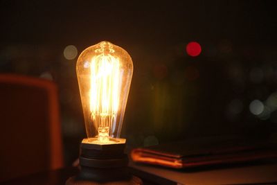 Close-up of illuminated light bulb