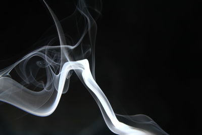 Close-up of smoke against black background