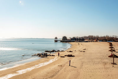 View of beach against clear sky