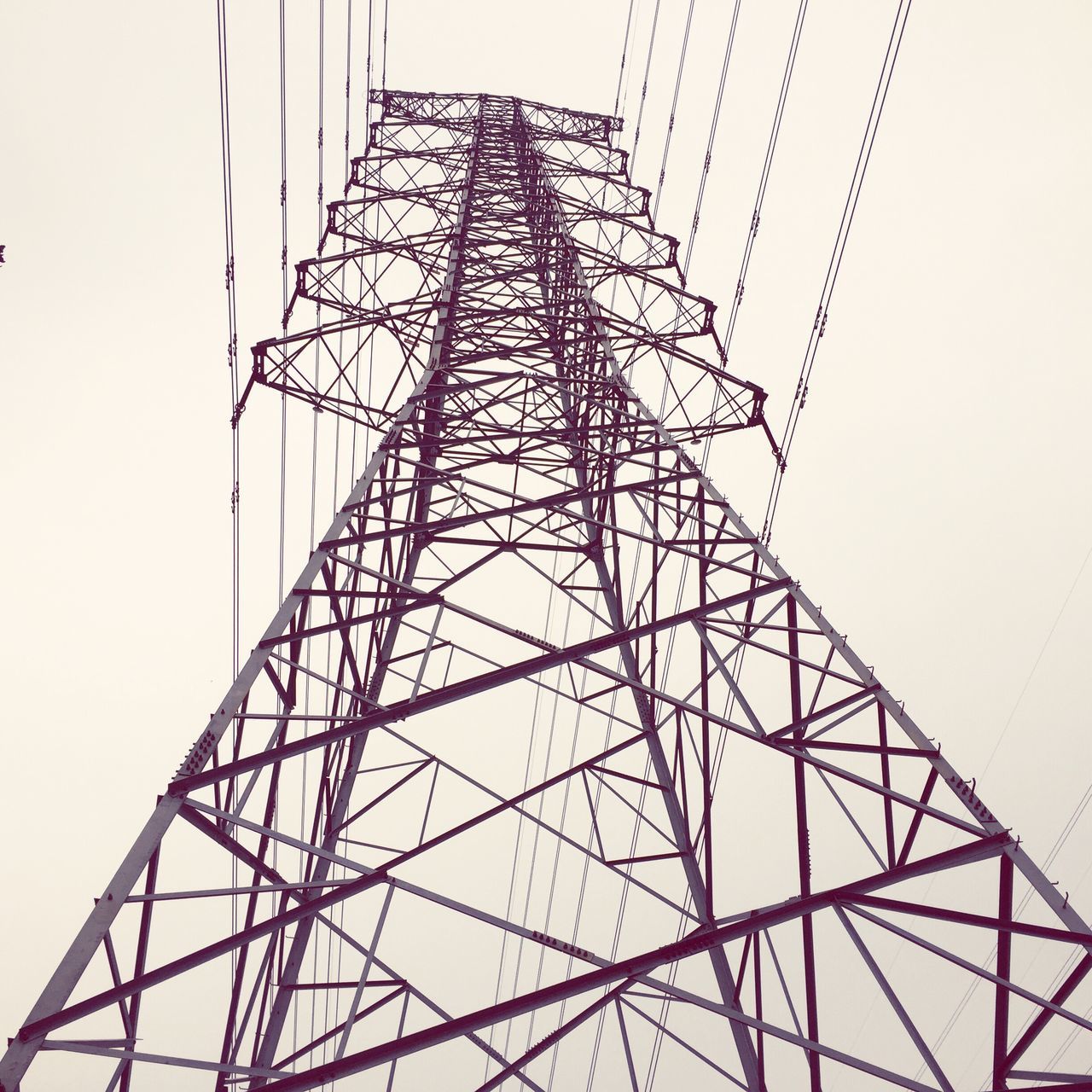 low angle view, clear sky, electricity pylon, connection, fuel and power generation, power line, technology, power supply, tall - high, electricity, sky, built structure, metal, day, cable, no people, tower, outdoors, metallic, architecture
