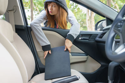 Woman sitting in car