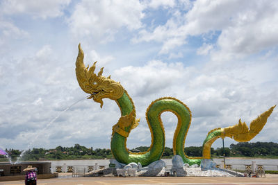 Low angle view of statue against sky