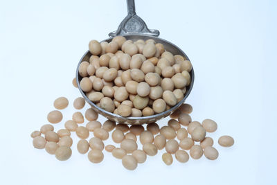 Close-up of eggs against white background