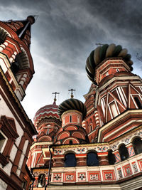 Low angle view of building against cloudy sky