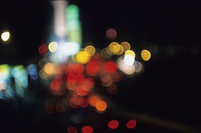 Defocused image of illuminated lights at night