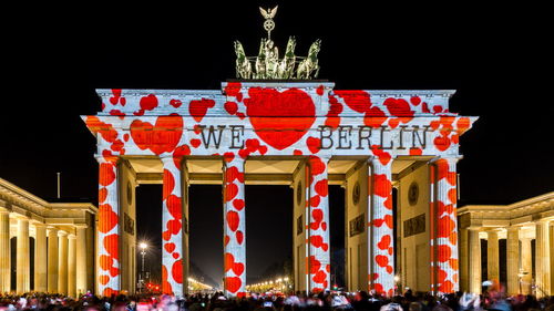 View of red bell tower at night