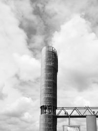 Low angle view of bnw. architecture and her design against sky