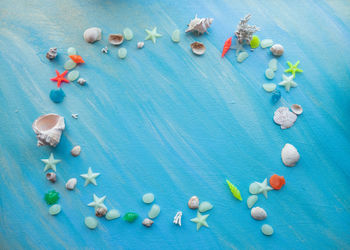 High angle view of candies against blue background