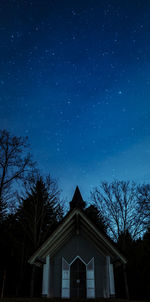 Low angle view of building against sky at night