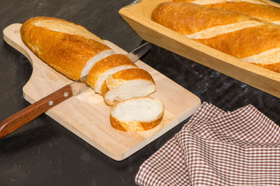 High angle view of bread on cutting board