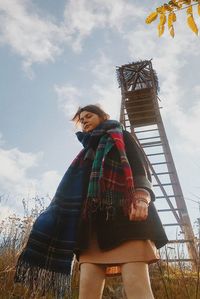 Low angle view of woman against sky