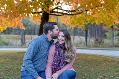 Young couple in park during autumn