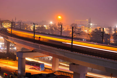 High angle view of light trails on road in city