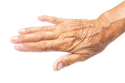 Close-up of hands over white background