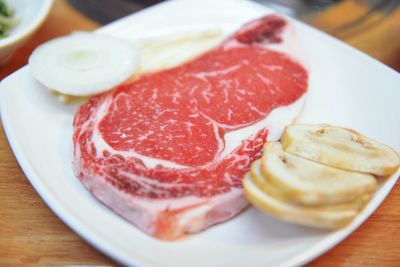 Close-up of meat in plate on table