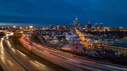 Light trails on road in city at night