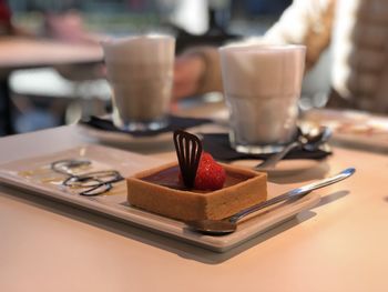 Close-up of coffee served on table