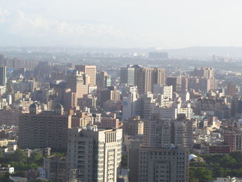 Modern buildings in city against sky