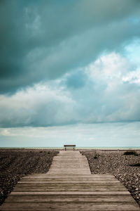 Pier over sea against sky