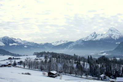 Scenic view of snow covered mountains against sky