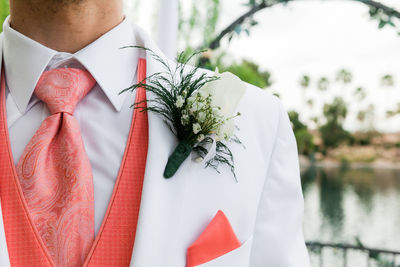 Midsection of bride during wedding ceremony