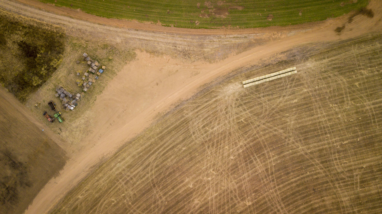 HIGH ANGLE VIEW OF DIRT ROAD