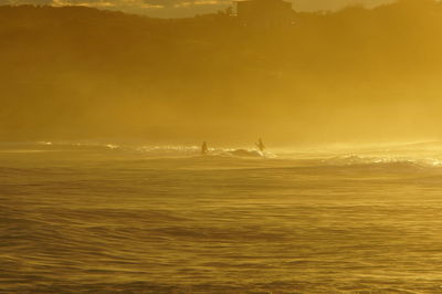 Scenic view of sea at sunset